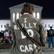 A woman wears a jacket reading I really do care at the US Supreme Court in Washington, DC, on May 2, 2022.